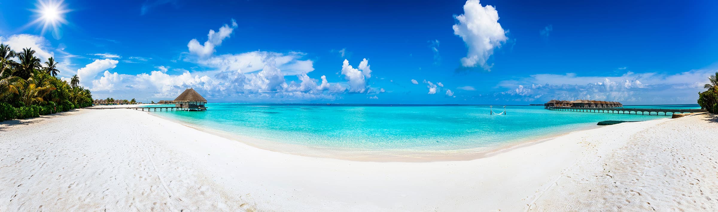 Overwater villas on a turquoise lagoon, one of Indian Rounds' island destinations